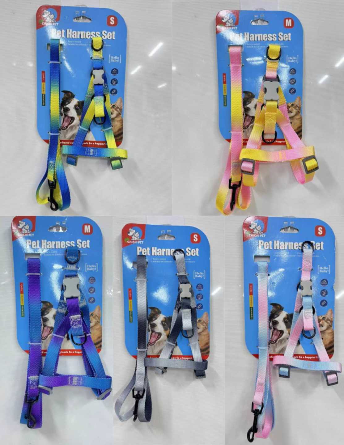 Set of dog harnesses in various colors on packaging with a white background